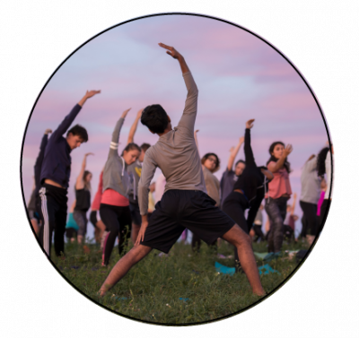 Students and staff doing sunrise yoga on horsebarn hill